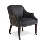 Modern charcoal armchair with patterned back and caster wheels.