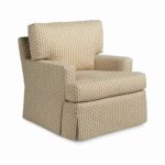 Skirted armchair with a small floral block print pattern.