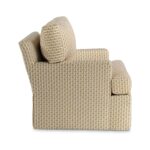 Side profile of an armchair with a patterned fabric.