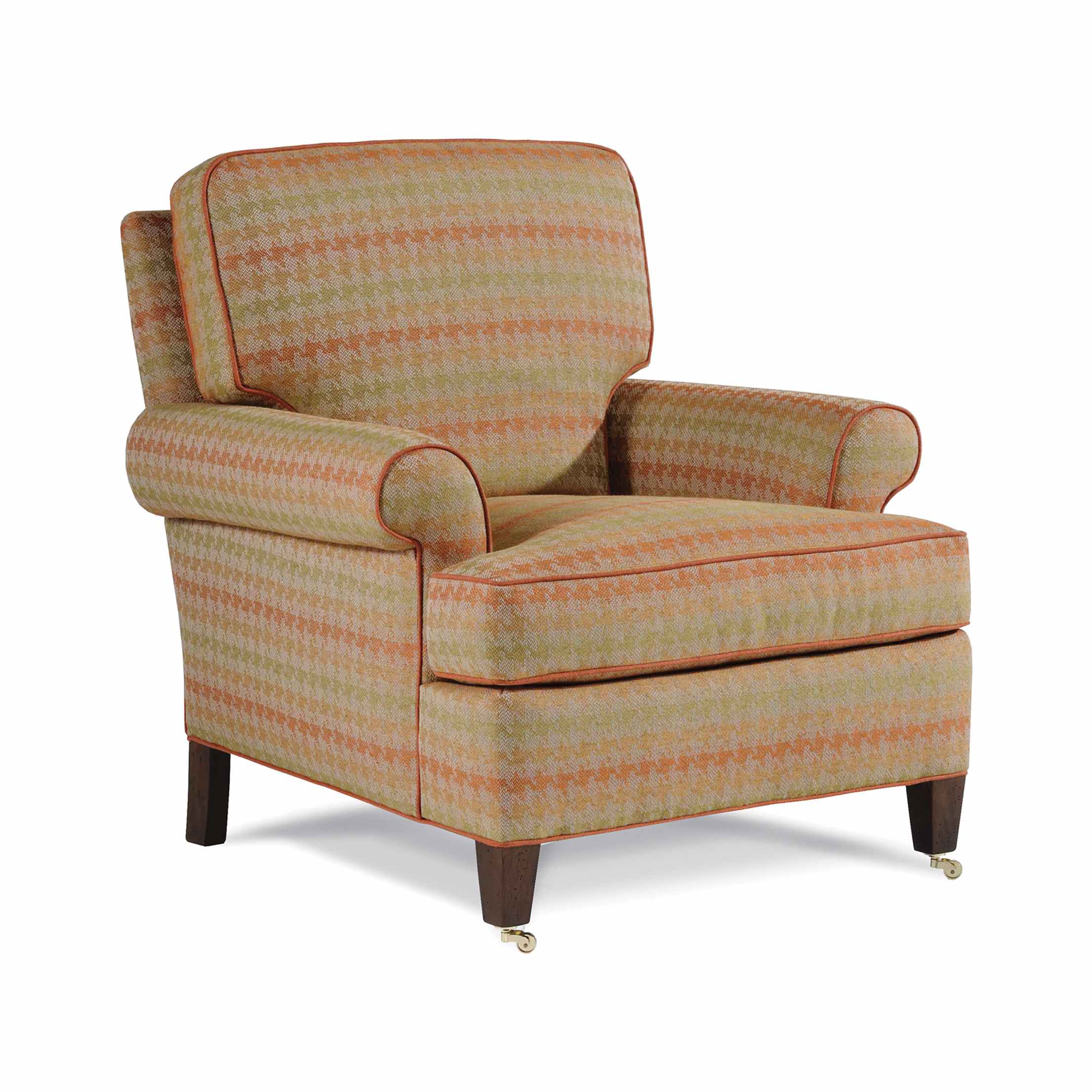 babington chair Upholstered armchair with orange and green patterned fabric.
