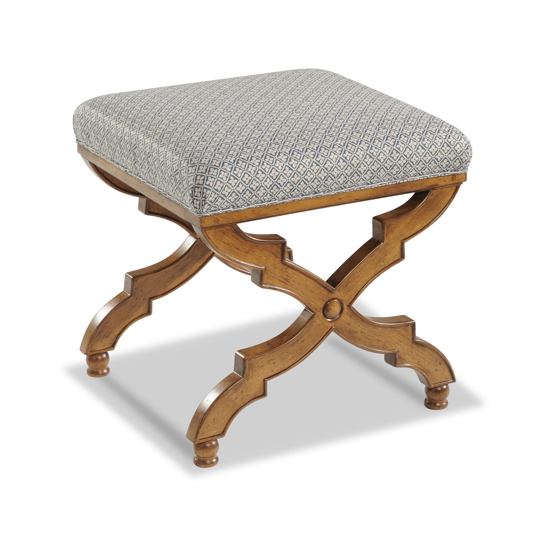 blenheim ottoman Traditional upholstered ottoman with ornate X-shaped wooden legs.