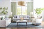 Bright living room with patterned furniture and green accents.