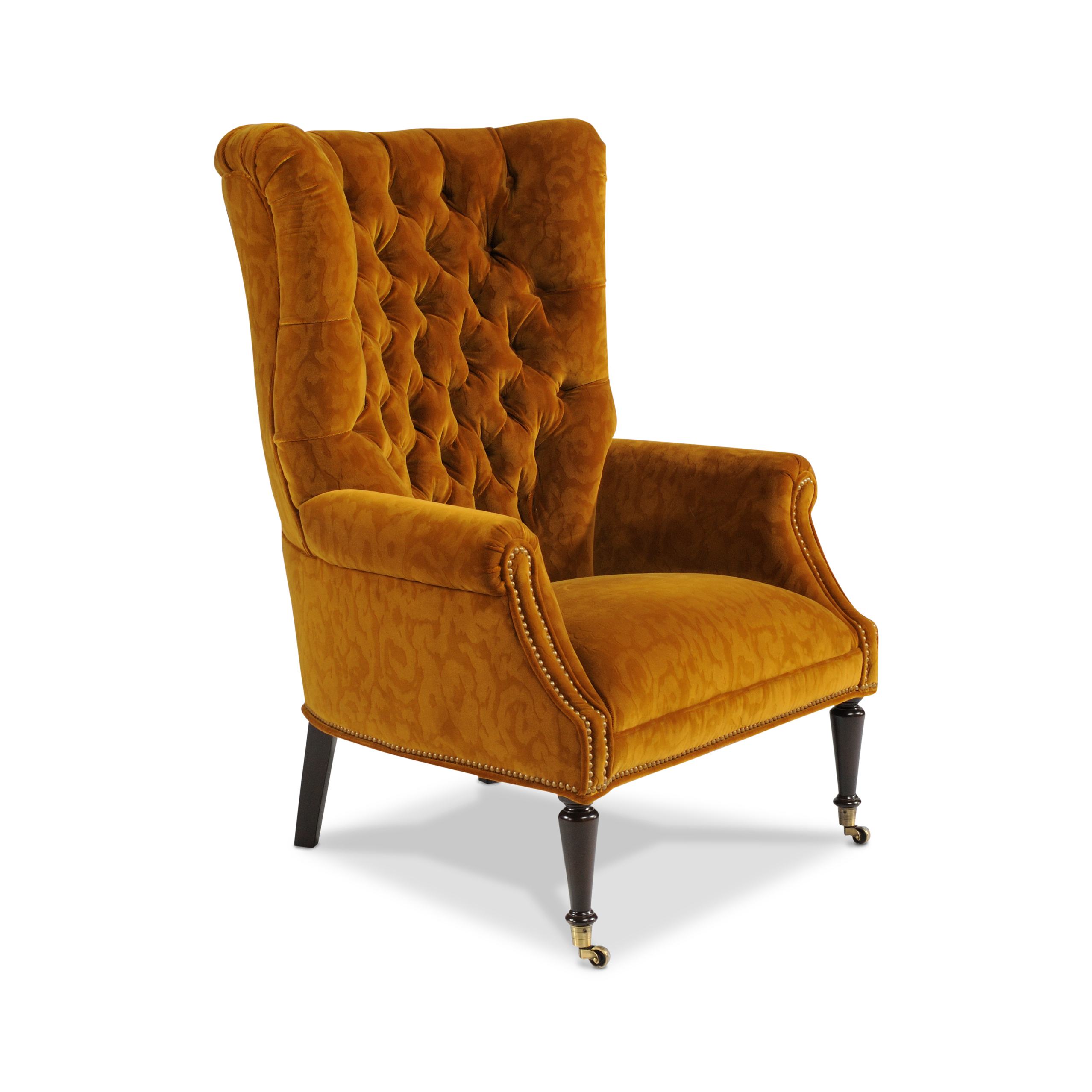 inkling chair Mustard yellow tufted wingback armchair with brass nailhead trim.