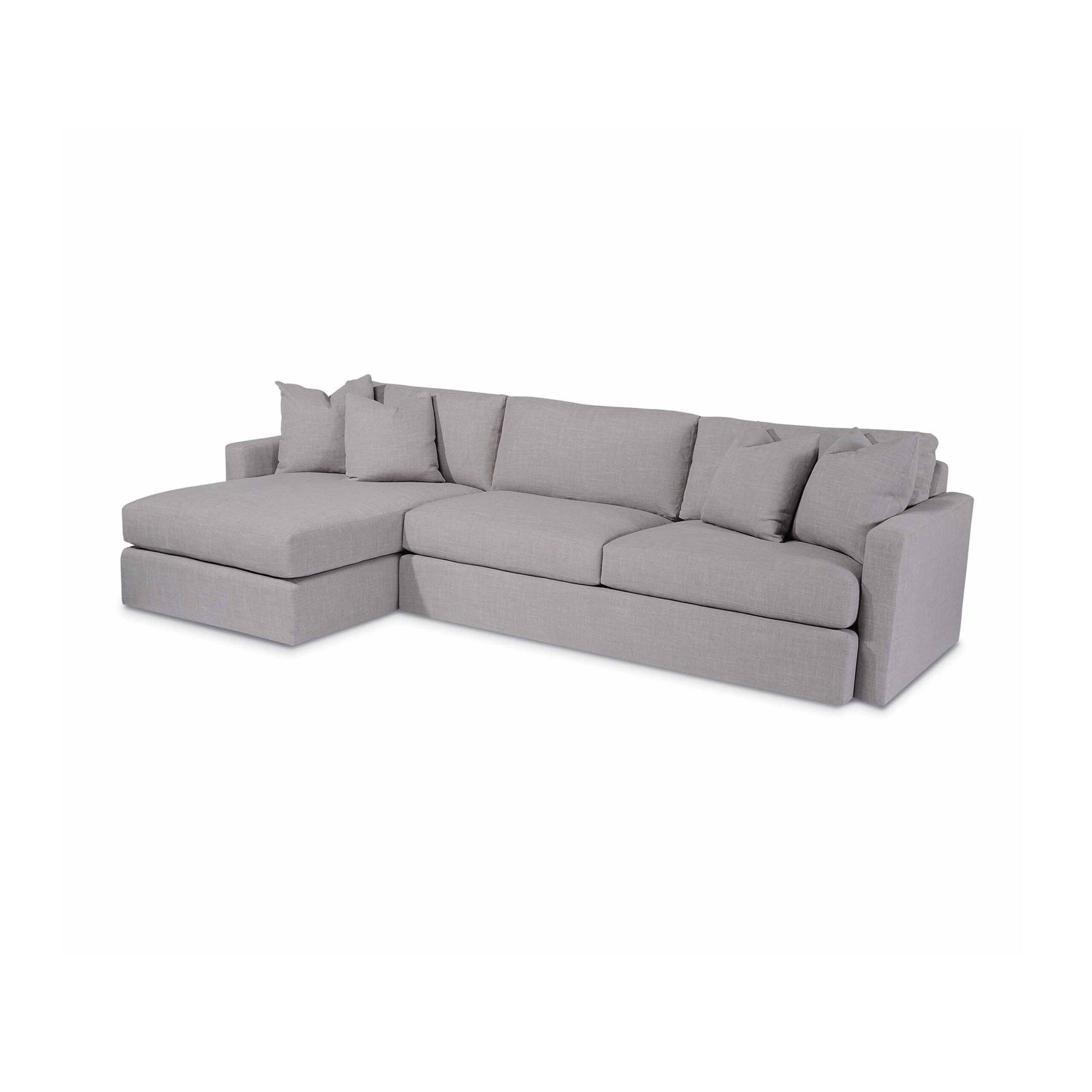 jackson sectional Modern light gray sectional sofa with chaise and throw pillows.