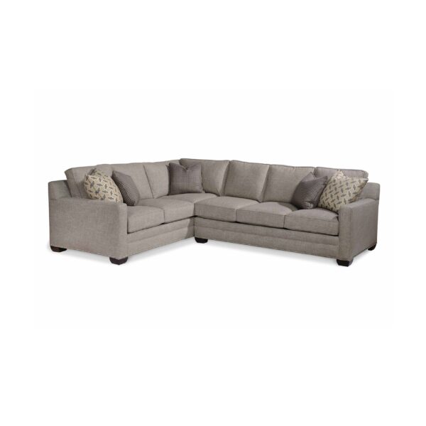 L-shaped light gray sectional sofa with decorative throw pillows.