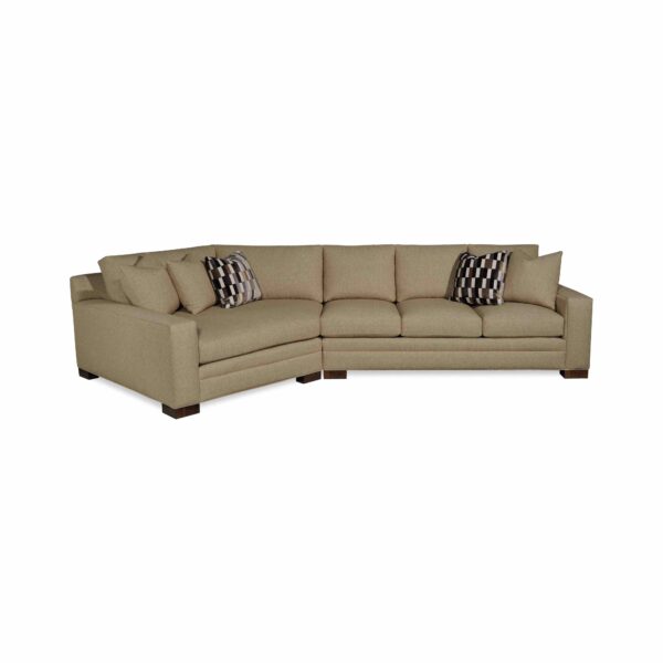 Large tan sectional sofa with geometric patterned accent pillows.