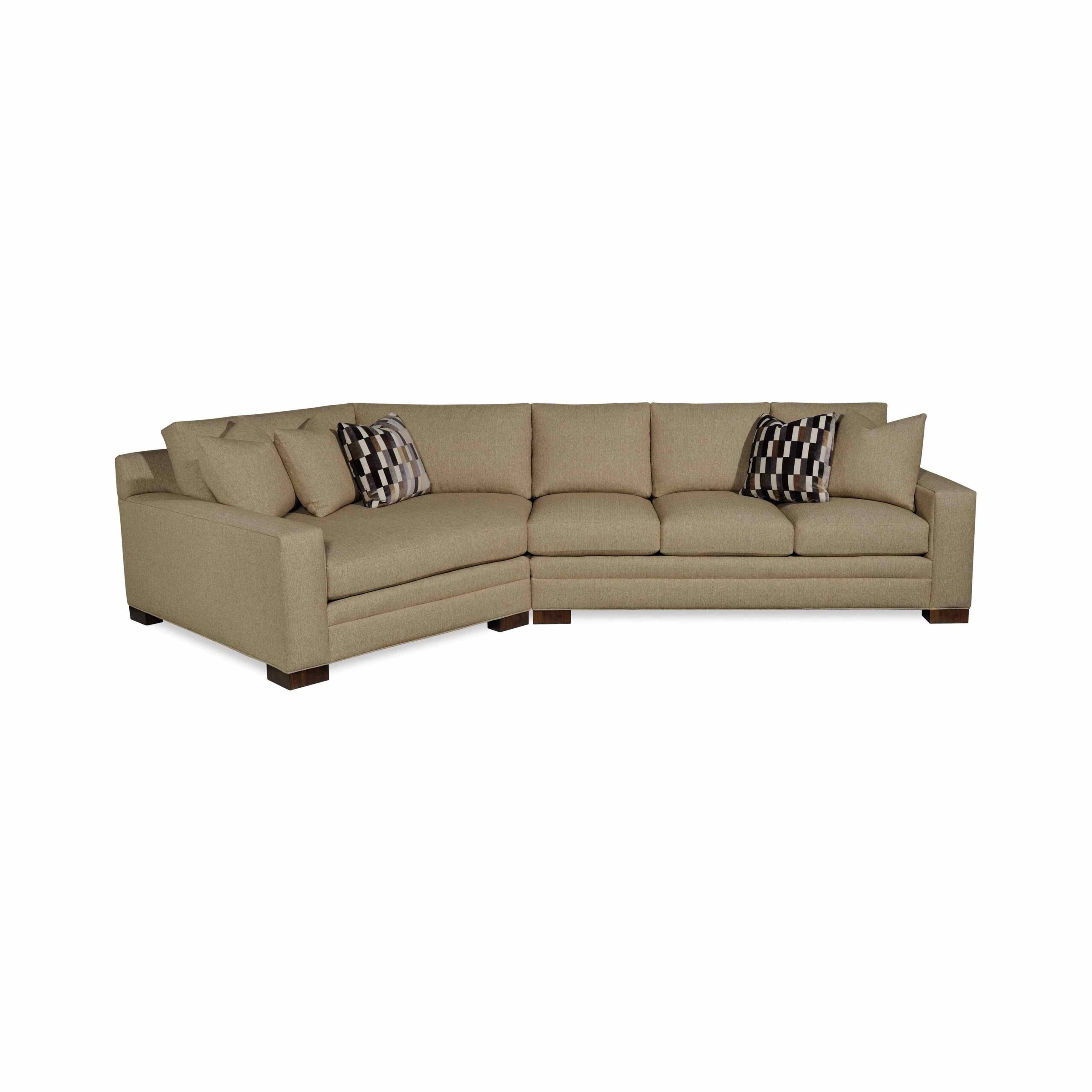 taylor made plush sectional Large tan sectional sofa with geometric patterned accent pillows.
