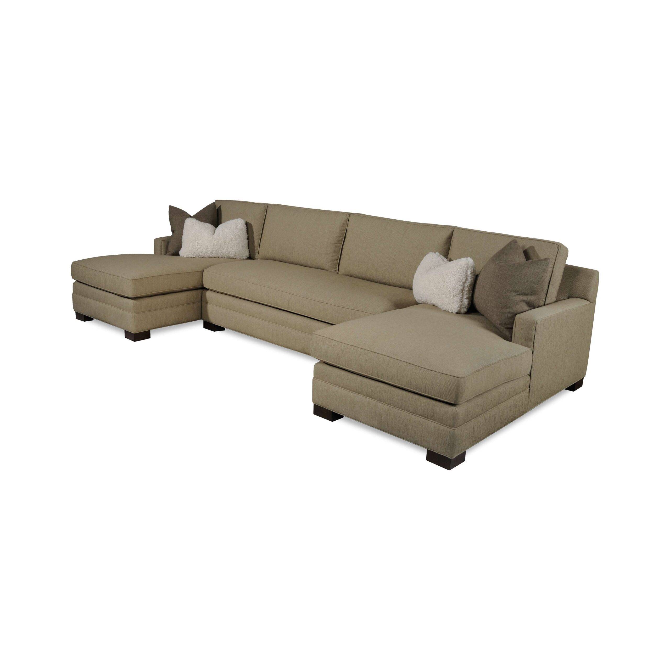 taylor made plush sectional Large beige U-shaped sectional sofa with double chaises and pillows.