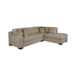 A beige fabric L-shaped sectional sofa with a chaise.