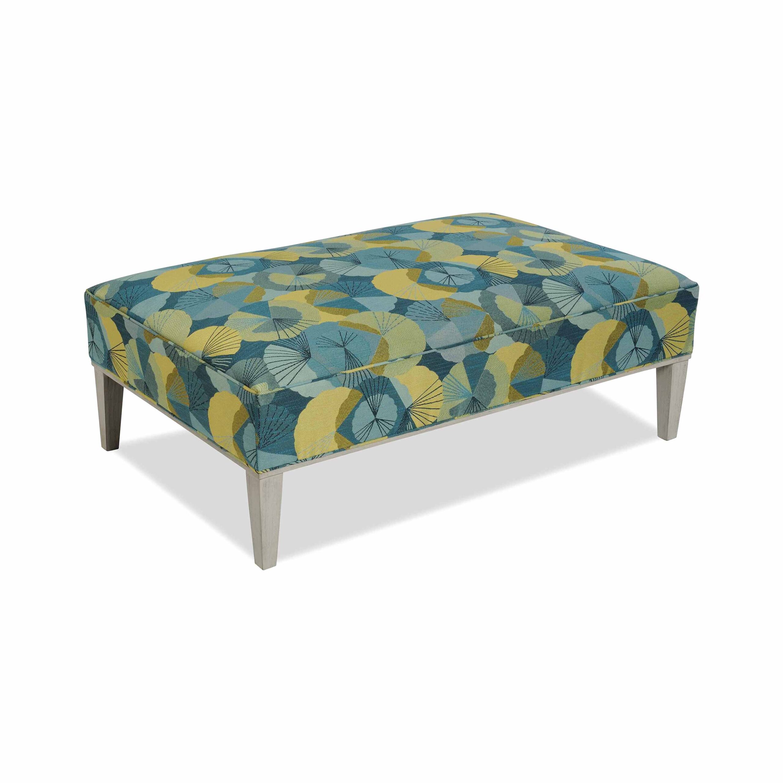 taylor made rectangular ottoman Rectangular ottoman with blue and yellow patterned fabric and wooden legs.