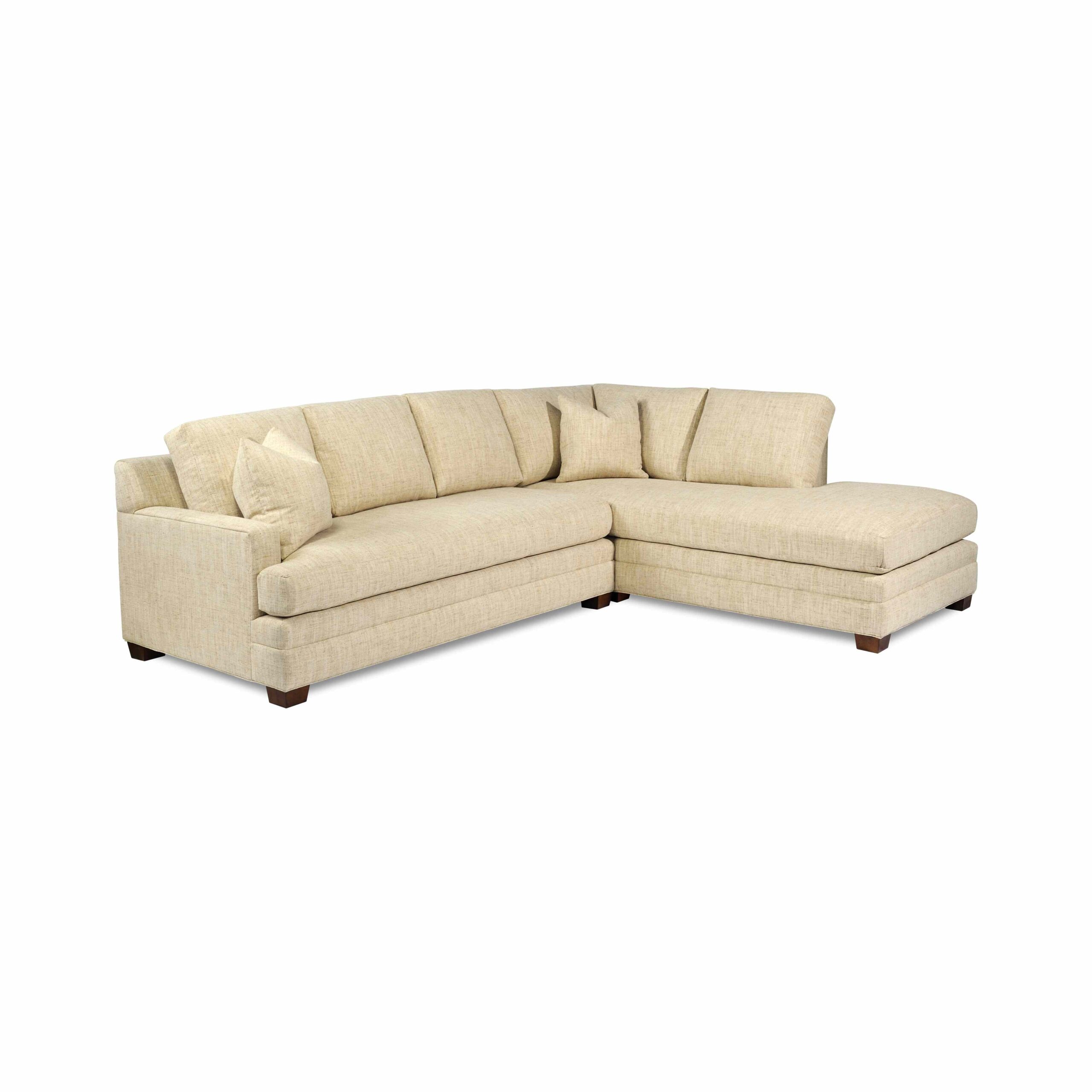 taylor made standard sectional Large cream-colored fabric sectional sofa with a chaise lounge.