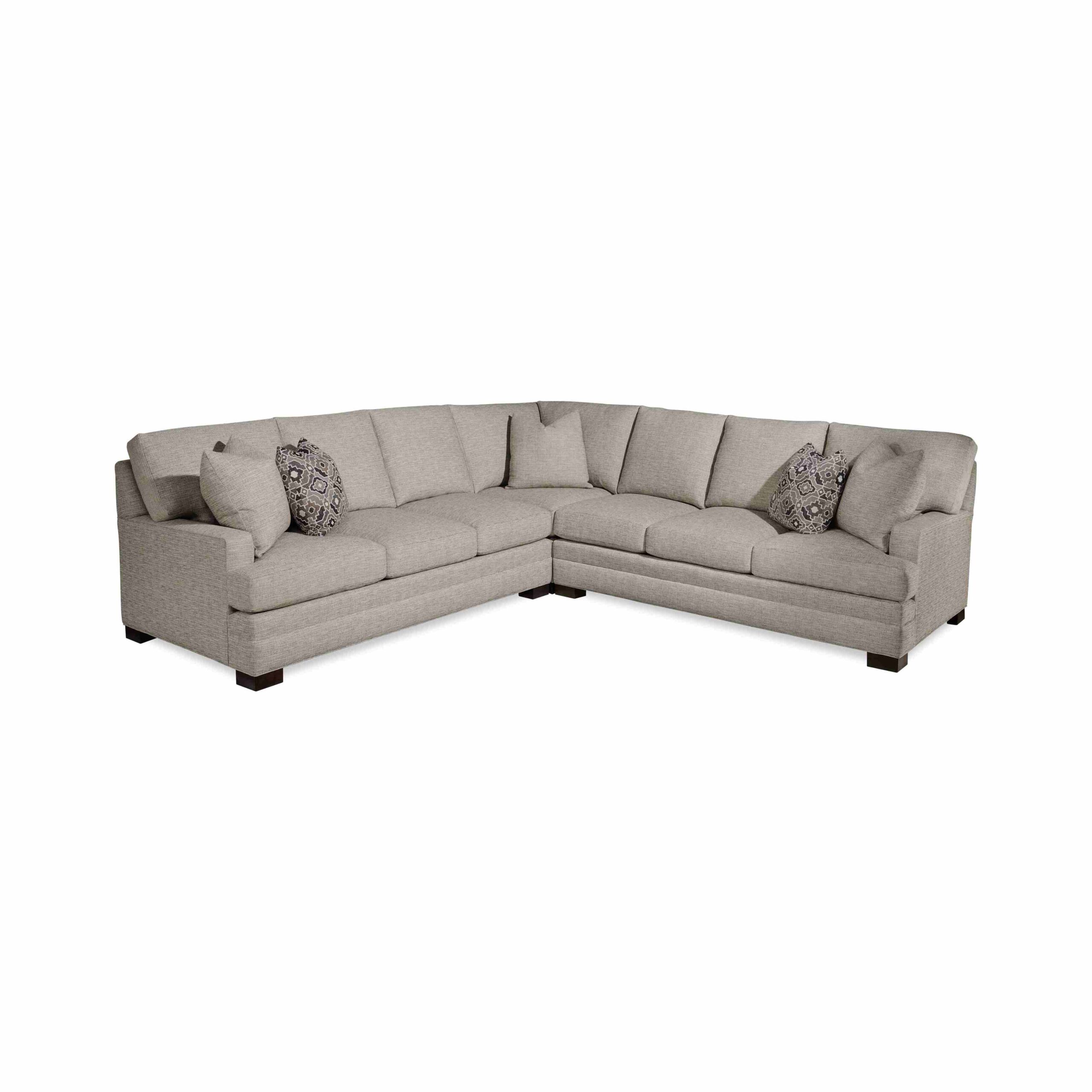 taylor made tall sectional Large L-shaped grey sectional sofa with decorative throw pillows.